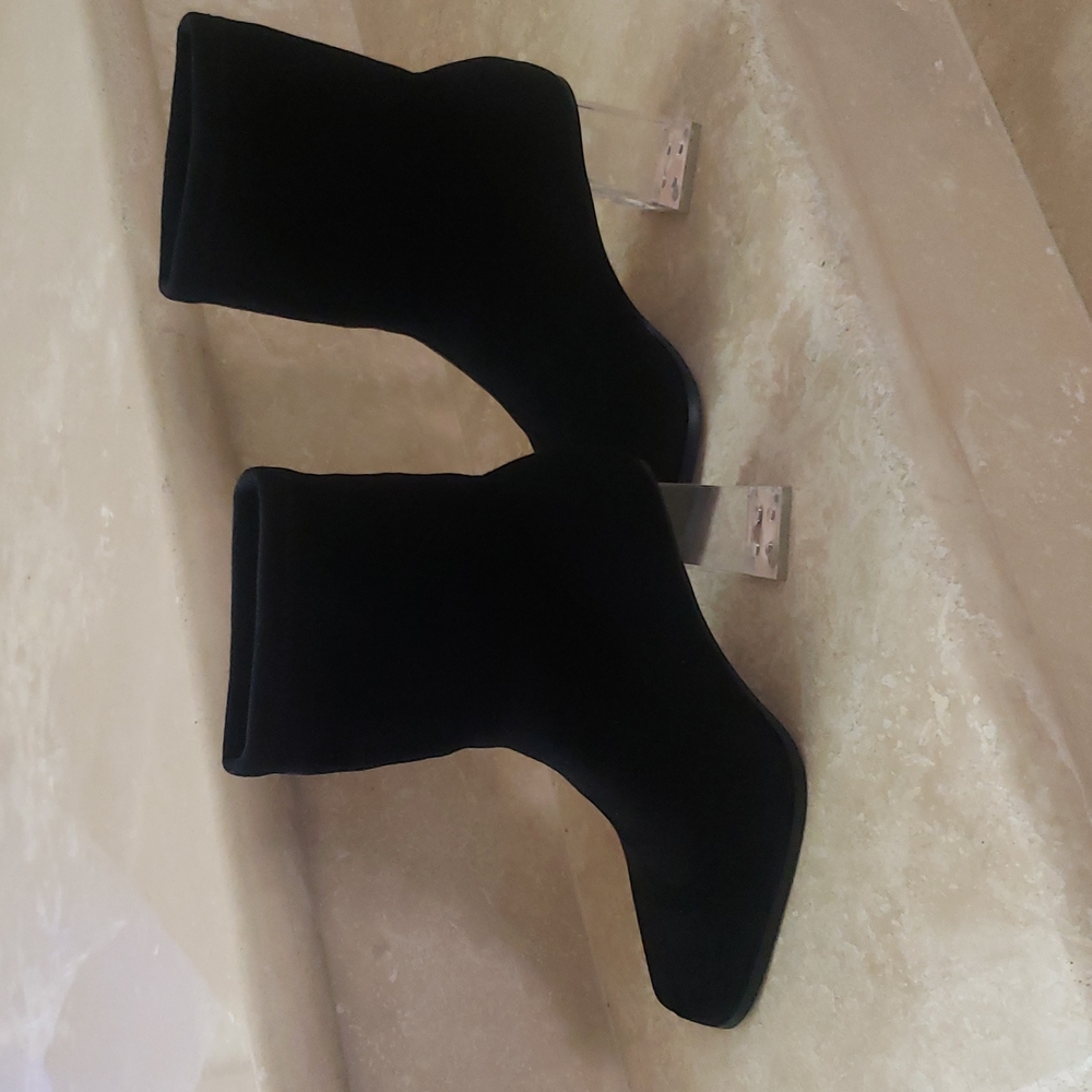 Clear block heels black booties.